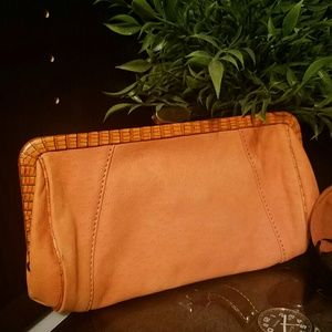 Leather clutch with edgy leopard lining